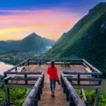 Tourist walking at Pha chom nang viewpoint in Nong Khiaw, Laos.