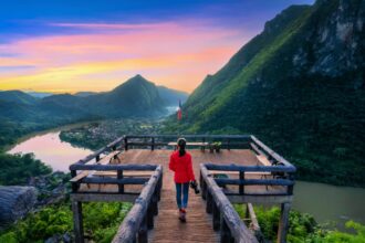 Tourist walking at Pha chom nang viewpoint in Nong Khiaw, Laos.