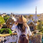 Young Tourist Admiring A View Of Barcelona From Park Guell, Spain