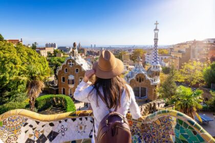 Young Tourist Admiring A View Of Barcelona From Park Guell, Spain