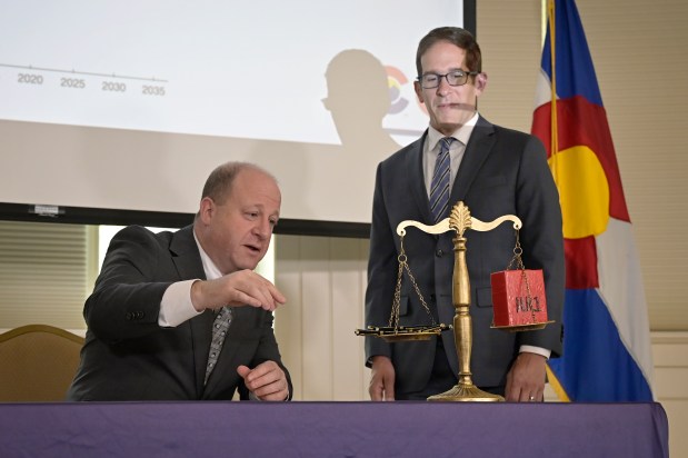 Jared Polis cut Colorado's Proposition 123 program to balance budget