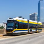 Dallas DART train passing skyline