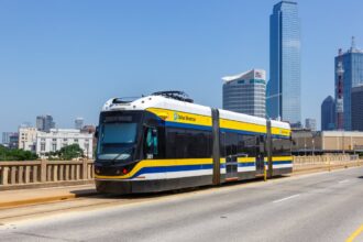 Dallas DART train passing skyline