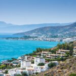 Whitewashed hillside townscape of Elounda, Crete, Greece