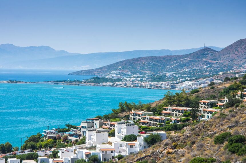 Whitewashed hillside townscape of Elounda, Crete, Greece