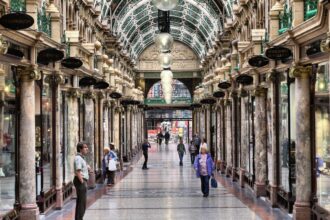 People visiting shops of Victoria Quarter in Leeds, UK