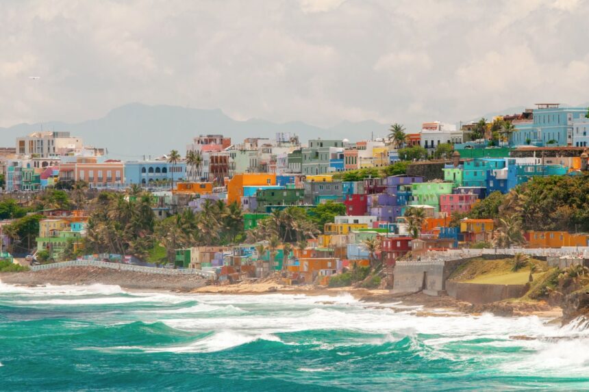 Colorful hillside homes along crashing waves in San Juan, Puerto Rico