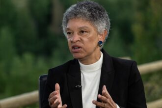 Boston Fed President Collins advocates holding rates steady, sees 'high bar' for further cuts