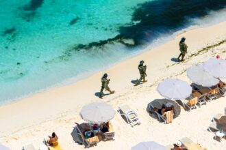 Marina soldiers of Mexican army patrolling beach in Cancun