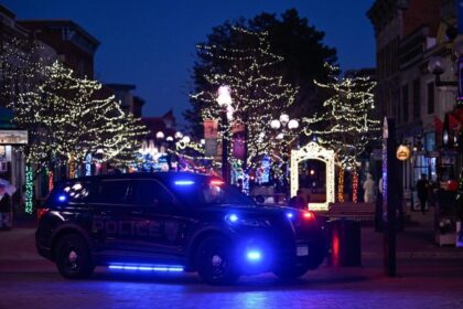 Boulder Jewish community lights Menorah on site of Pearl Street attack