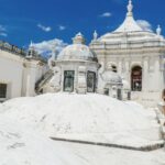 Tourist visiting vibrant white cathedral in Leon, Nicaragua