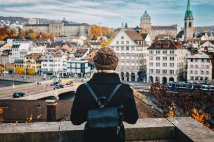A Young Woman Admiring A View Of Zurich, Switzerland