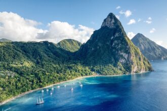 Aerial view of yachts anchored in front of the Gros Piton mountain peak in Soufriere, Saint Lucia