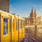 A Yellow Berlin Metro Approaching Oberbaumbr&uuml;cke Bridge In Berlin, Germany