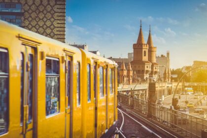 A Yellow Berlin Metro Approaching Oberbaumbr&uuml;cke Bridge In Berlin, Germany