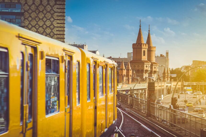 A Yellow Berlin Metro Approaching Oberbaumbr&uuml;cke Bridge In Berlin, Germany