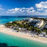 Aerial view of Isla Mujeres, Mexico with blue waters, beaches, and a resort