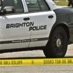 Brighton driver injured in crash with train, police say