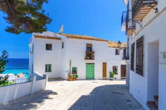 Whitewashed Old Town street in Altea, Spain
