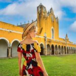 Woman in Izamal, Mexico with yellow building in the background