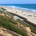 Coastal bluff with stairs from the road to the beach taken in Carlsbad, CA