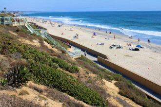 Coastal bluff with stairs from the road to the beach taken in Carlsbad, CA