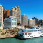 Hart Plaza in downtown Detroit, Michigan, featuring the skyline of modern skyscrapers and the iconic Detroit Princess riverboat