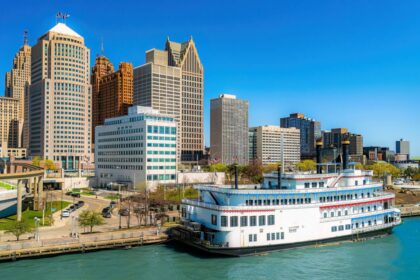 Hart Plaza in downtown Detroit, Michigan, featuring the skyline of modern skyscrapers and the iconic Detroit Princess riverboat