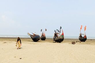 Woman in traditional garb on Bangladesh beach