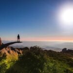 Hiker posing at Potato Chip Rock in San Diego