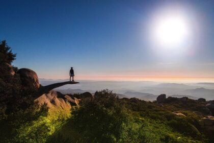 Hiker posing at Potato Chip Rock in San Diego