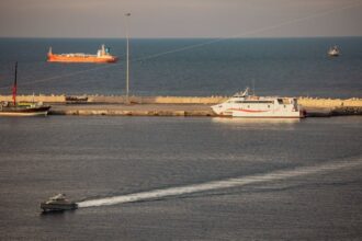 U.S. Intelligence Warns Iran Unlikely To Ease Hormuz Strait Chokehold Soon, Sources Say