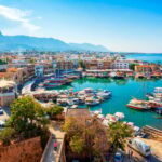Panoramic view of Kyrenia (Girne) old harbour on the northern coast of Cyprus. Kyrenia seaside of Mediterranean Sea, Cyprus. Famous places and travel destination of Kyrenia, Cyprus