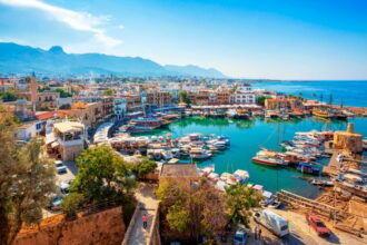 Panoramic view of Kyrenia (Girne) old harbour on the northern coast of Cyprus. Kyrenia seaside of Mediterranean Sea, Cyprus. Famous places and travel destination of Kyrenia, Cyprus