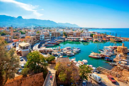 Panoramic view of Kyrenia (Girne) old harbour on the northern coast of Cyprus. Kyrenia seaside of Mediterranean Sea, Cyprus. Famous places and travel destination of Kyrenia, Cyprus