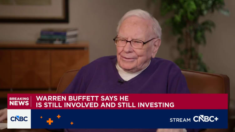 Warren Buffett says he's still making investment calls at Berkshire, flags 'tiny' buy