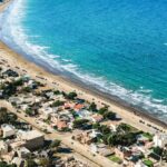 Close-up of Rada Tilly beach in Chubut, Argentina with blue sea and beautiful houses