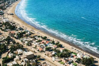 Close-up of Rada Tilly beach in Chubut, Argentina with blue sea and beautiful houses