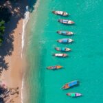 Banner Travel photo Thailand. Aerial view turquoise water, tropical beach Phuket with longtail boat.
