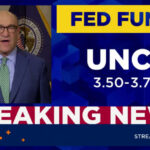 Fed holds rates steady amid dissent
