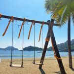 Beachside swingset in Zihuatanejo, Mexico