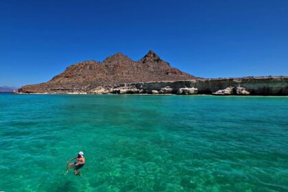 Wading in pristine turquoise waters of Loreto, Mexico